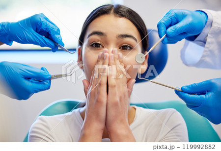 Woman, dental patient and scared or shock for healthcare, portrait and medical surgery. Female person, overwhelmed or dentist hand with tools, frightened anxiety for toothache or fear in chair 119992882