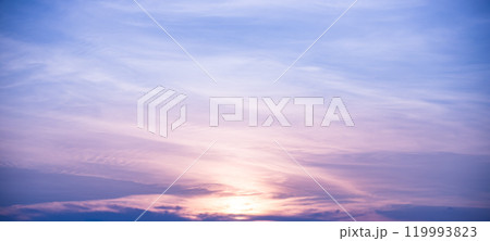 Beautiful dramatic scenic after sunset sky background after sunset, luxury soft gradient orange gold clouds and sunlight on the blue sky perfect for the background 119993823
