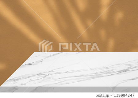 Minimal White Marble Table Corner with Leaves Shadow and Beige Beam on Concrete Wall Background Minimal White Marble Table Corner with Leaves Shadow and Beige Beam on Concrete Wall Background 119994247
