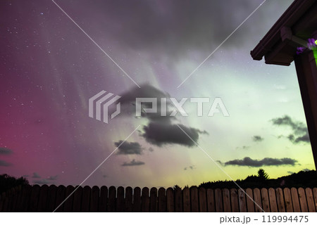 The Aurora Borealis, the northern lights, showing up above bungalow in County Donegal, Ireland 119994475