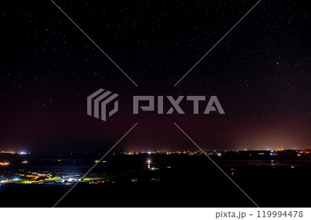 Starlink satellites trail passing above County Donegal, Ireland 119994478