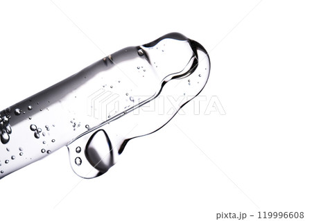 Dropper pipette with delicious serum with bubbles close-up. 119996608