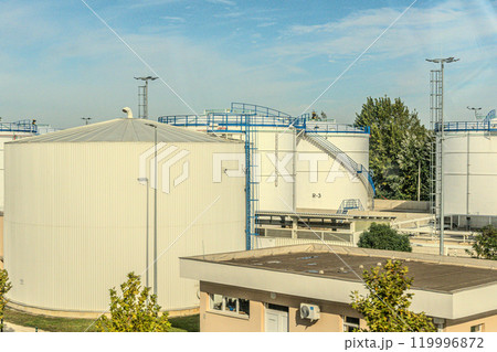 White fuel storage tank against blue sky. High quality photo 119996872