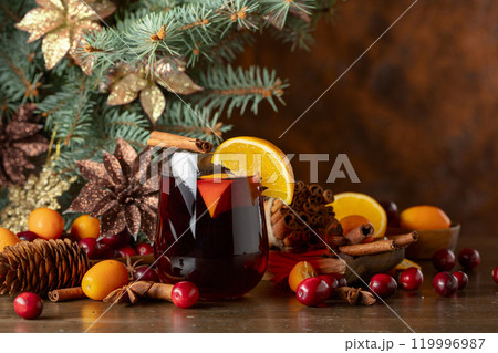 Christmas cocktail with spices, cranberries, and citrus. 119996987