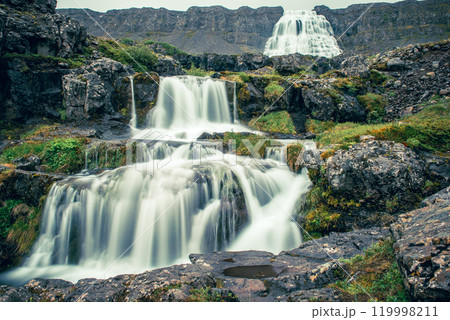 Dynjandi is one the most famous waterfall of the West Fjords of Iceland at summer Dynjandi is one the most famous waterfall of the West Fjords of Iceland at summer 119998211