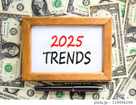 Planning 2025 trends new year symbol. Concept words 2025 Trends on beautiful wooden picture frame. Beautiful background from dollar bills. Black pen. Business 2025 trends new year concept. Copy space. Planning 2025 trends new year symbol. Concept words 2025 Trends on beautiful wooden picture frame. Beautiful background from dollar bills. Black pen. Business 2025 trends new year concept. Copy space. 119998299