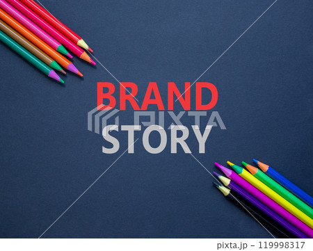 Brand story branding symbol. Concept words Brand story on beautiful black paper. Beautiful black paper background. Beautiful colored pencils Business brand story branding concept. Copy space. 119998317