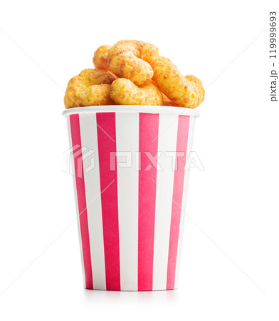 Puffed crispy Peanut flips in cup isolated on white background. 119999693