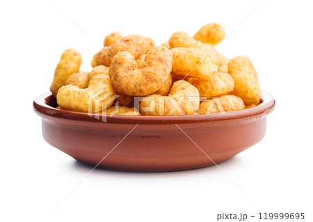 Puffed crispy Peanut flips in bowl isolated on white background. Puffed crispy Peanut flips in bowl isolated on white background. 119999695