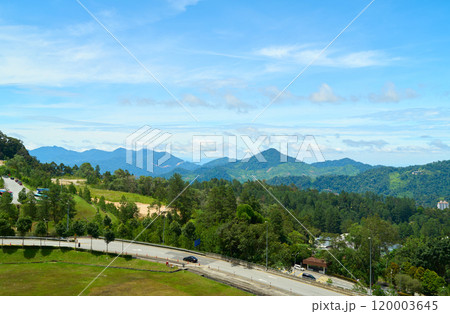 Winding road leading through lush green mountains in malaysia Winding road leading through lush green mountains in malaysia 120003645