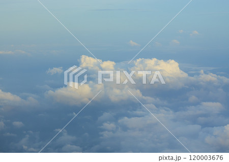 White clouds are forming above the horizon in a blue sky White clouds are forming above the horizon in a blue sky 120003676