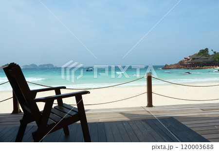 Wooden chair standing on a terrace facing the sea in redang island Wooden chair standing on a terrace facing the sea in redang island 120003688