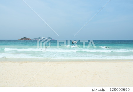 Turquoise ocean water lapping on the white sand beach in redang island, malaysia 120003690