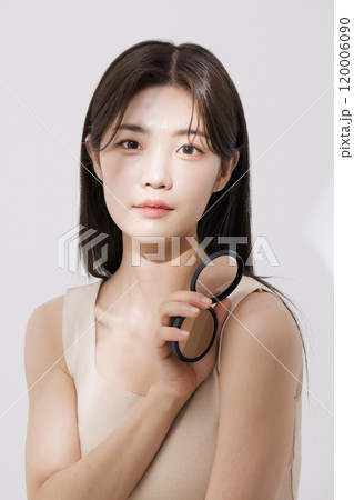 A woman posing with a blusher A woman posing with a blusher 120006090