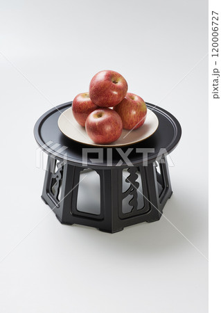 A pile of apples on a plate on the refreshment table A pile of apples on a plate on the refreshment table 120006727
