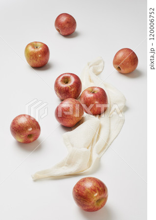 Several apples placed with a cloth on a white background Several apples placed with a cloth on a white background 120006752