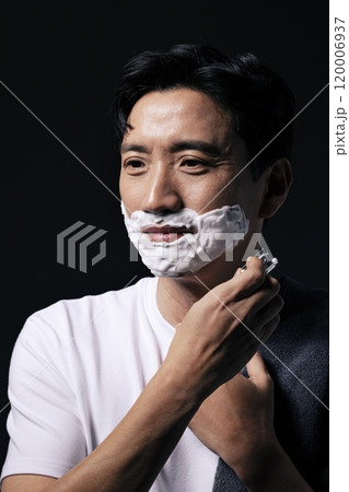 A middleaged man about to start shaving A middleaged man about to start shaving 120006937