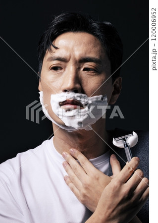 Middleaged man shaving with foam Middleaged man shaving with foam 120006952