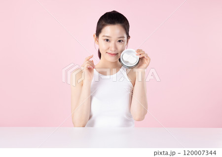 Teenage woman trying out nose pads Teenage woman trying out nose pads 120007344