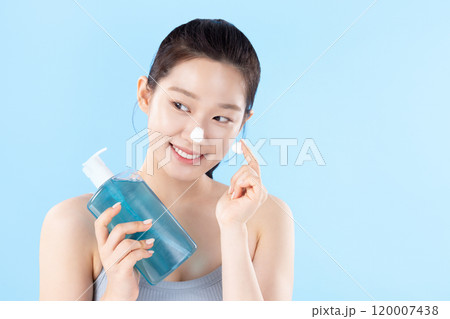 A teenage woman posing with cosmetics A teenage woman posing with cosmetics 120007438