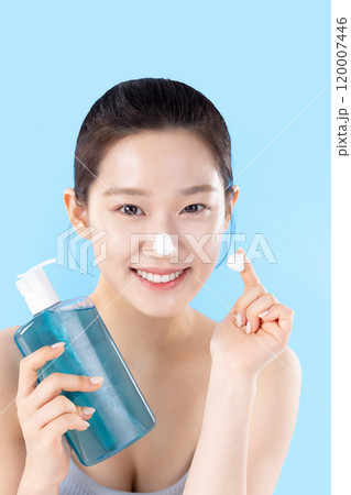 A teenage woman posing with cosmetics A teenage woman posing with cosmetics 120007446