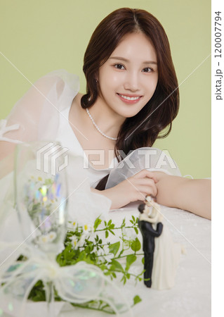 A woman in her 20s enjoying a bridal shower ahead of her wedding A woman in her 20s enjoying a bridal shower ahead of her wedding 120007794