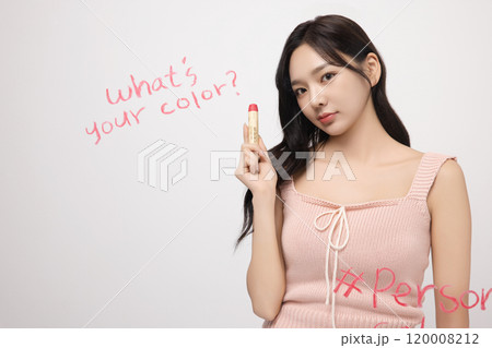 A woman in her 20s writing on a transparent wall with lipstick A woman in her 20s writing on a transparent wall with lipstick 120008212