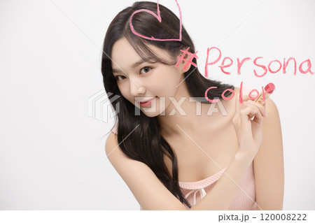 A woman in her 20s writing on a transparent wall with lipstick A woman in her 20s writing on a transparent wall with lipstick 120008222