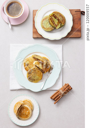 A combination of warm coffee and delicious hotteok A combination of warm coffee and delicious hotteok 120009557