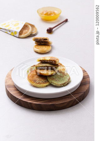 Hotteok plated on a wooden tray Hotteok plated on a wooden tray 120009562