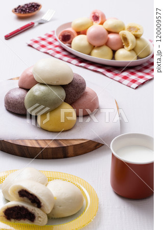 Cutely plated colorful and warm buns and milk Cutely plated colorful and warm buns and milk 120009577