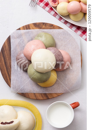 Cutely plated colorful and warm buns and milk Cutely plated colorful and warm buns and milk 120009579