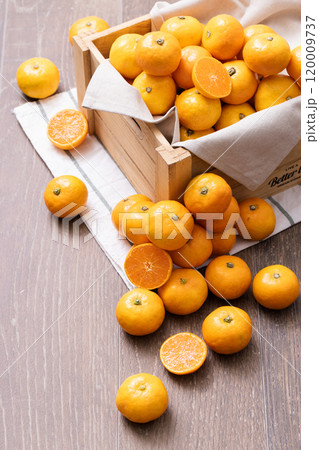 A box full of fresh tangerines A box full of fresh tangerines 120009737