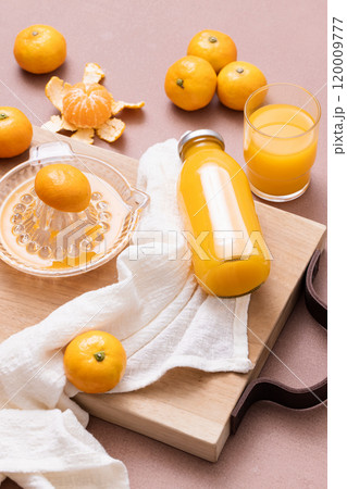 Making a drink with tangerines Making a drink with tangerines 120009777