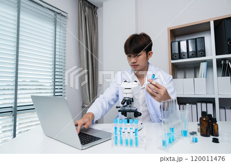 Young Scientist Conducting Innovative Drug Research in a Modern Laboratory Setting with Advanced Equipment Young Scientist Conducting Innovative Drug Research in a Modern Laboratory Setting with Advanced Equipment 120011476