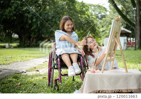 Close Friends, Disabled Young Women Enjoying Outdoor Drawing Session Together in a Park Close Friends, Disabled Young Women Enjoying Outdoor Drawing Session Together in a Park 120011663