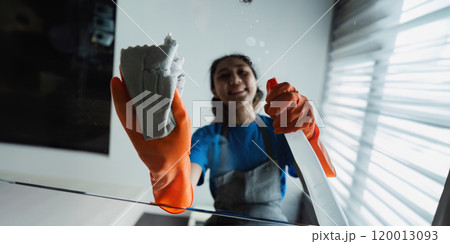 Housekeeping woman wiping the table in the living room House cleaning service concept Housekeeping woman wiping the table in the living room House cleaning service concept 120013093