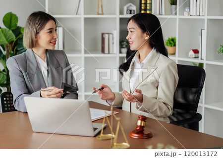 Lawyer working with client discussing contract document in office, consulting to help customer Lawyer working with client discussing contract document in office, consulting to help customer 120013172