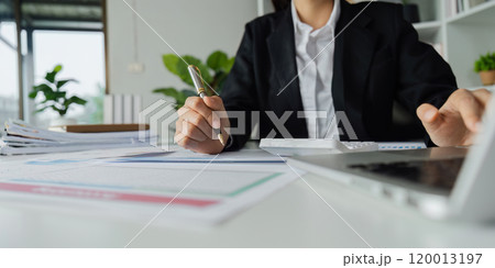 Accountant working on financial data analysis dashboard on paper as marketing indication for business strategic planning 120013197