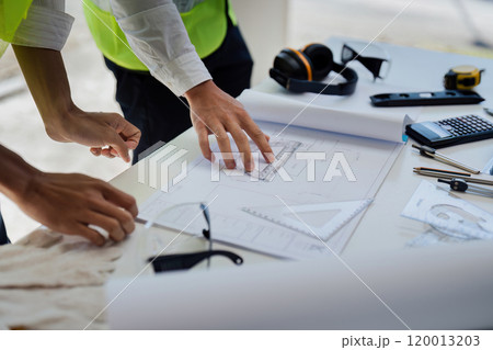 team engineer, foreman, architect meeting for colleagues discussing and checks construction blueprints at onsite team engineer, foreman, architect meeting for colleagues discussing and checks construction blueprints at onsite 120013203