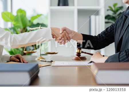 Lawyer handshake with a client making about documents, contracts, agreements, cooperation agreement 120013358