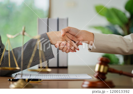 Lawyer handshake with a client making about documents, contracts, agreements, cooperation agreement 120013392