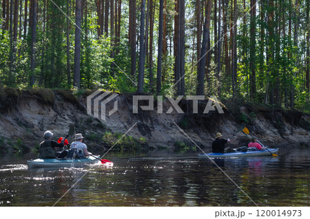 Group kayak trip for seigneur and senora . An elderly couple And adult rowing boat on the river, a water hike, a summer adventure. Age-related sports, mental youth and health, tourism, active old age Group kayak trip for seigneur and senora . An elderly couple And adult rowing boat on the river, a water hike, a summer adventure. Age-related sports, mental youth and health, tourism, active old age 120014973