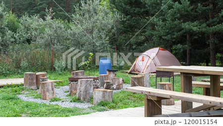 Installed tourist tent in a camping in nature in the forest. Domestic tourism, active summer holidays, family adventures. Ecotourism, sport, hike. Copy space, mock up 120015154