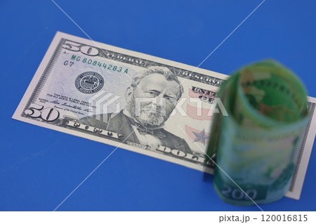 Russian rubles on the background of euro banknotes. The concept of the exchange rate, sanctions, 120016815