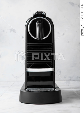 Espresso home coffee machine in light kitchen background. Espresso home coffee machine in light kitchen background. 120019266