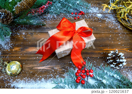 Christmas wooden background with snowflake and a gift. Top view of copy space for text 120021637