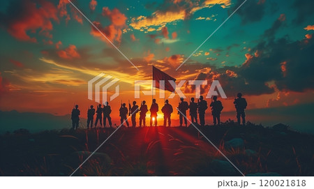 Silhouetted Soldiers Holding a Flag Against a Stunning Sunset Sky on a Distant Mountain 120021818