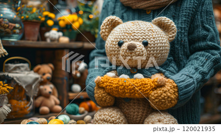 A Cozy Teddy Bear Wearing a Knitted Hat Enjoys Snowfall in a Serene Winter Forest Setting 120021935