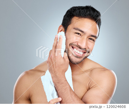 Beauty, cleaning and grooming with portrait of man in studio on gray background for cosmetic wellness. Dermatology, skincare and towel with face of happy person in bathroom for hydration or hygiene Beauty, cleaning and grooming with portrait of man in studio on gray background for cosmetic wellness. Dermatology, skincare and towel with face of happy person in bathroom for hydration or hygiene 120024608